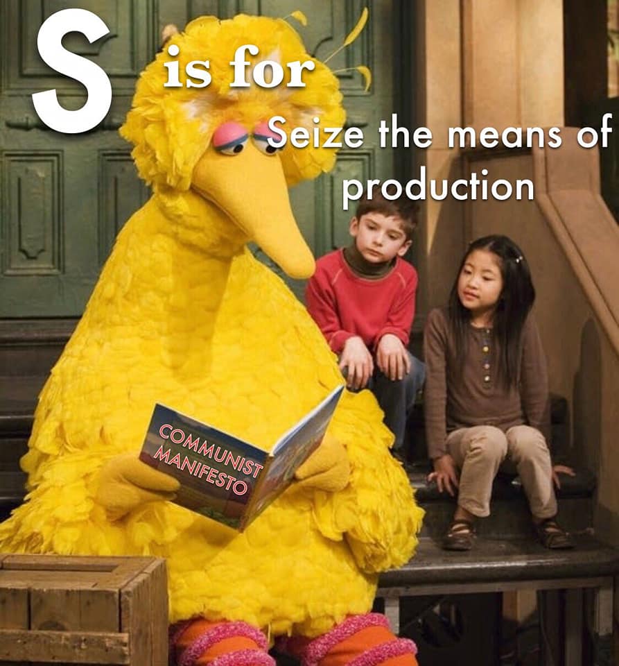 The meme features Big Bird from Sesame Street, but instead of reading a book, he's holding a book with the title "Communist Manifesto" and a sarcastic expression. The text above him reads "S is for Seize the means of production" and "Seize the means of production" is written above him in a smaller font. The meme is a play on the classic Sesame Street alphabet song, but with a communist twist.