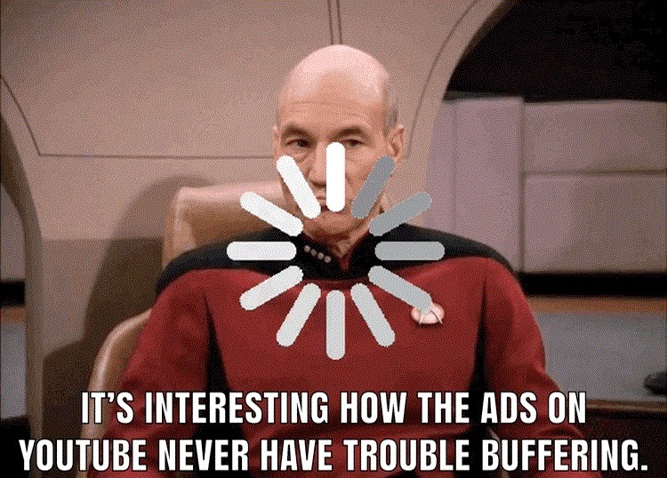 This meme features a screenshot of a loading animation from a YouTube video, with a still image of Captain Jean-Luc Picard from the TV show Star Trek: The Next Generation. The text overlay reads: "It's interesting how the ads on YouTube never have trouble buffering."