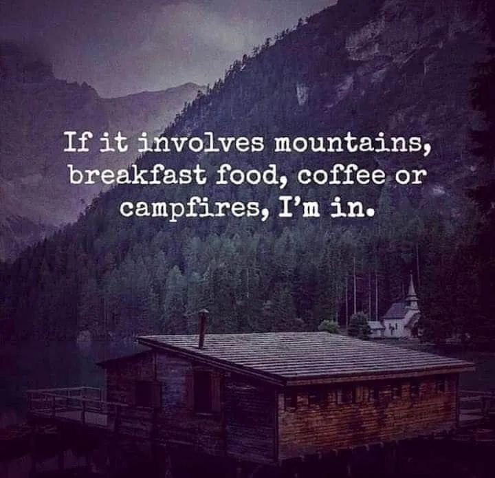 This meme is a humorous image with a simple text overlay. The text reads: "If it involves mountains, breakfast food, coffee, or campfires, I'm in." The image is likely a scenic landscape of a mountainous region with a small cabin or campsite, but the exact details are not specified.