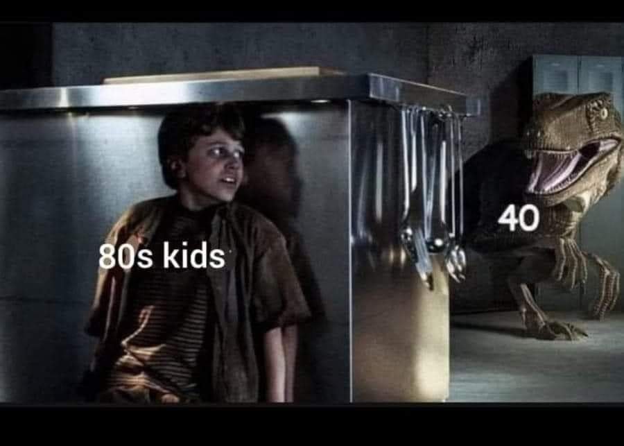 The meme is a humorous comparison between the fears of children from different eras. It features a picture of a child from the 1980s being terrified of a monster from a movie, with the caption "80s kids" and a picture of a child from the 1990s being terrified of a dinosaur from the movie "Jurassic Park", with the caption "90s kids".