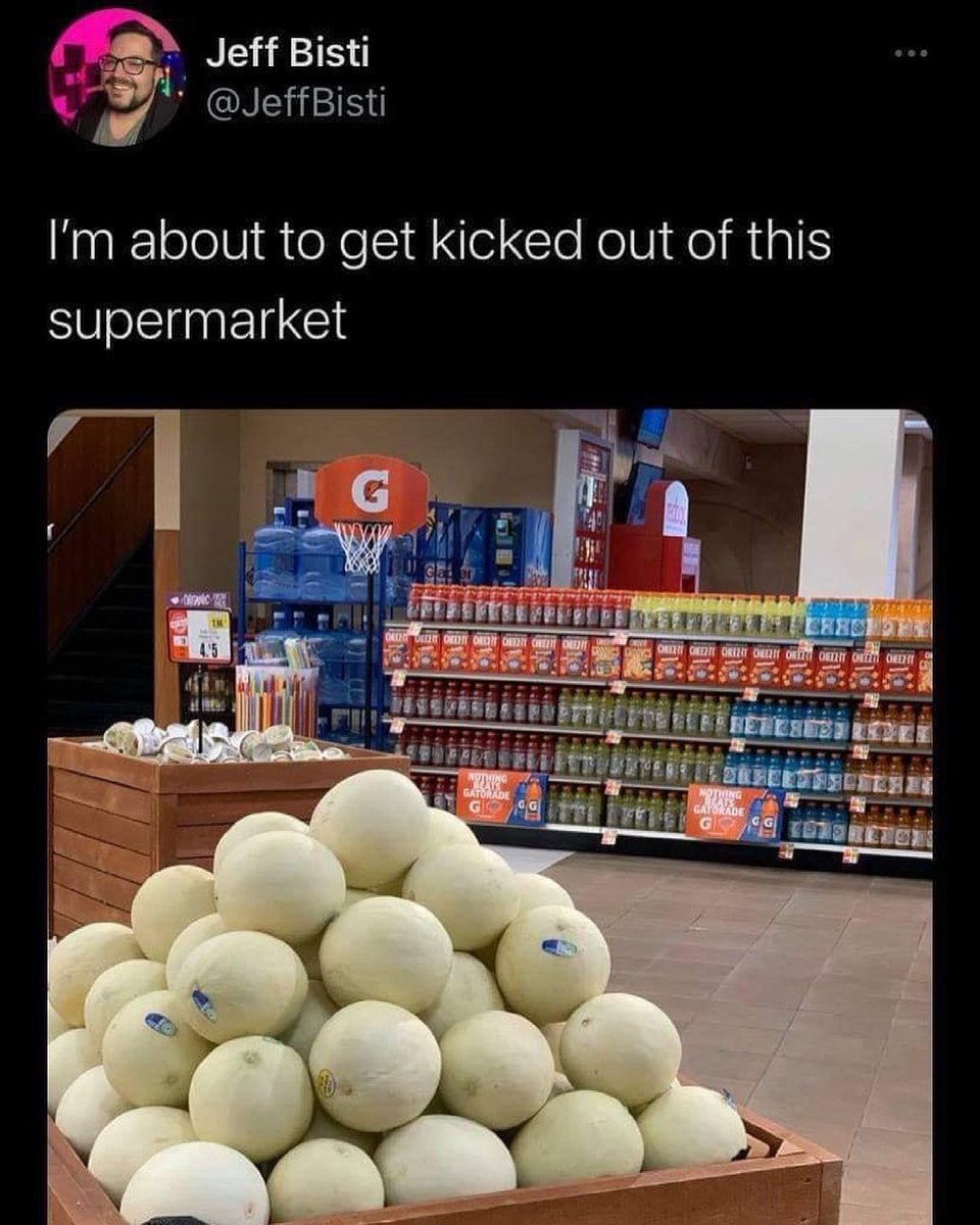 The meme is a photo of a grocery store with a basketball hoop in the produce section, surrounded by a large pile of cantaloupes. The image is captioned "I'm about to get kicked out of the store" and a separate text reads "I'm about to get kicked out of this supermarket".