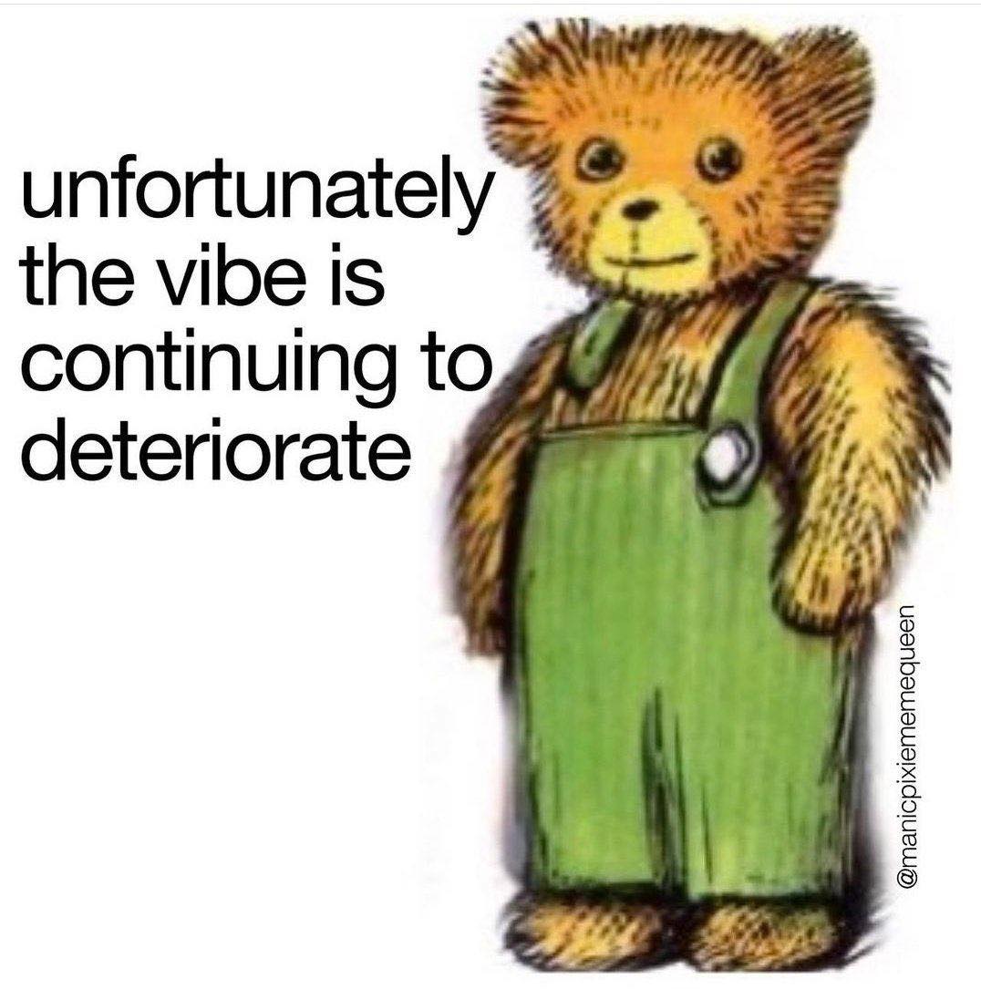 This meme features a cartoon bear in a green dress, with a cheerful expression. The text "I'M NOT OKAY" is written in bold, playful letters, contrasting with the bear's friendly demeanor. The meme is a humorous commentary on the disconnect between a person's emotional state and their outward appearance.