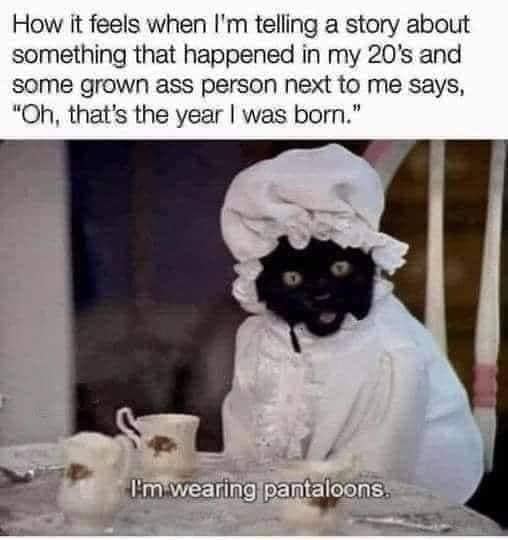 This meme is a humorous image with a caption. The image appears to be a person with a dark face and a white sheet covering their body, sitting at a table with a cup and saucer. The caption reads: "How it feels when I'm telling a story about something that happened in my 20's and someone older than me says 'Oh, that's the year I was born'".