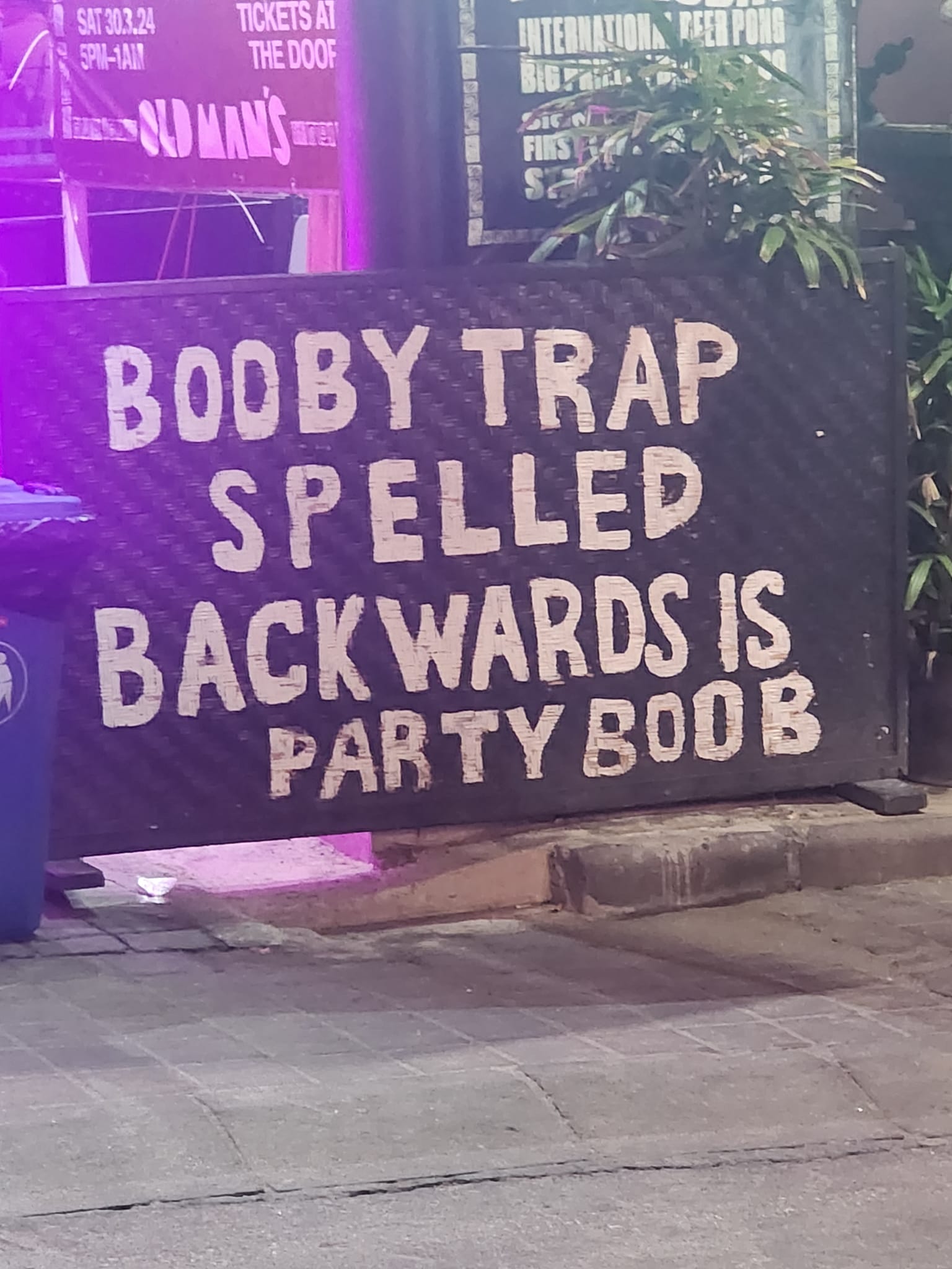 This meme is a playful take on the classic "Boo" phrase, but with a clever twist. The image shows a sign with the words "Boo" replaced with "Boo" spelled backwards, which is "ooB".