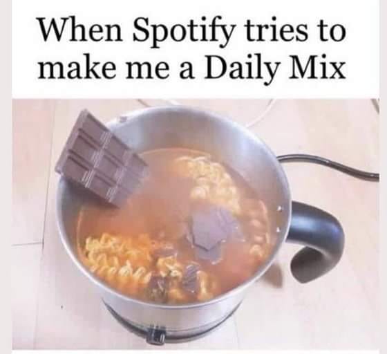 This meme is a humorous image of a bowl of noodles with a chocolate bar floating in the broth. The text above the image reads "When Spotify tries to make me a Daily Mix". The joke is that the image is a literal interpretation of the idea of a "Daily Mix" from Spotify, where the music streaming service tries to create a personalized playlist for the user, but in this case, it's a humorous and unexpected take on the idea.