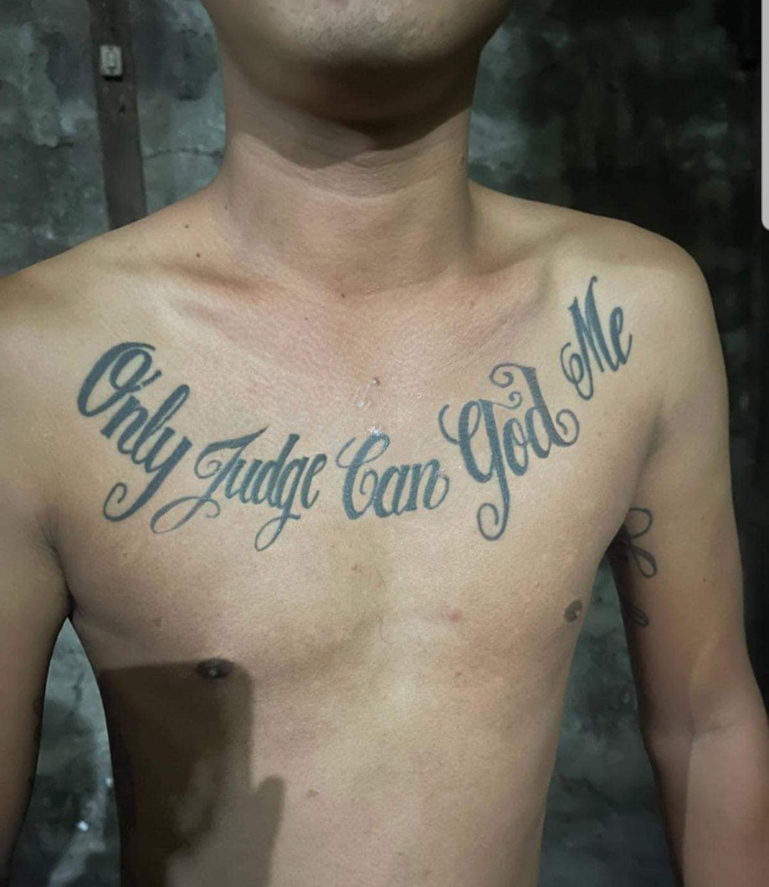 This meme is a photo of a person's chest with a tattoo that reads "Only God can judge me". The tattoo is a humorous and ironic take on the idea of being judged by a higher power, implying that the person is so morally ambiguous that only God can make a judgment. The phrase is often used in a sarcastic or tongue-in-cheek way to express that one is above the law or has no moral accountability.