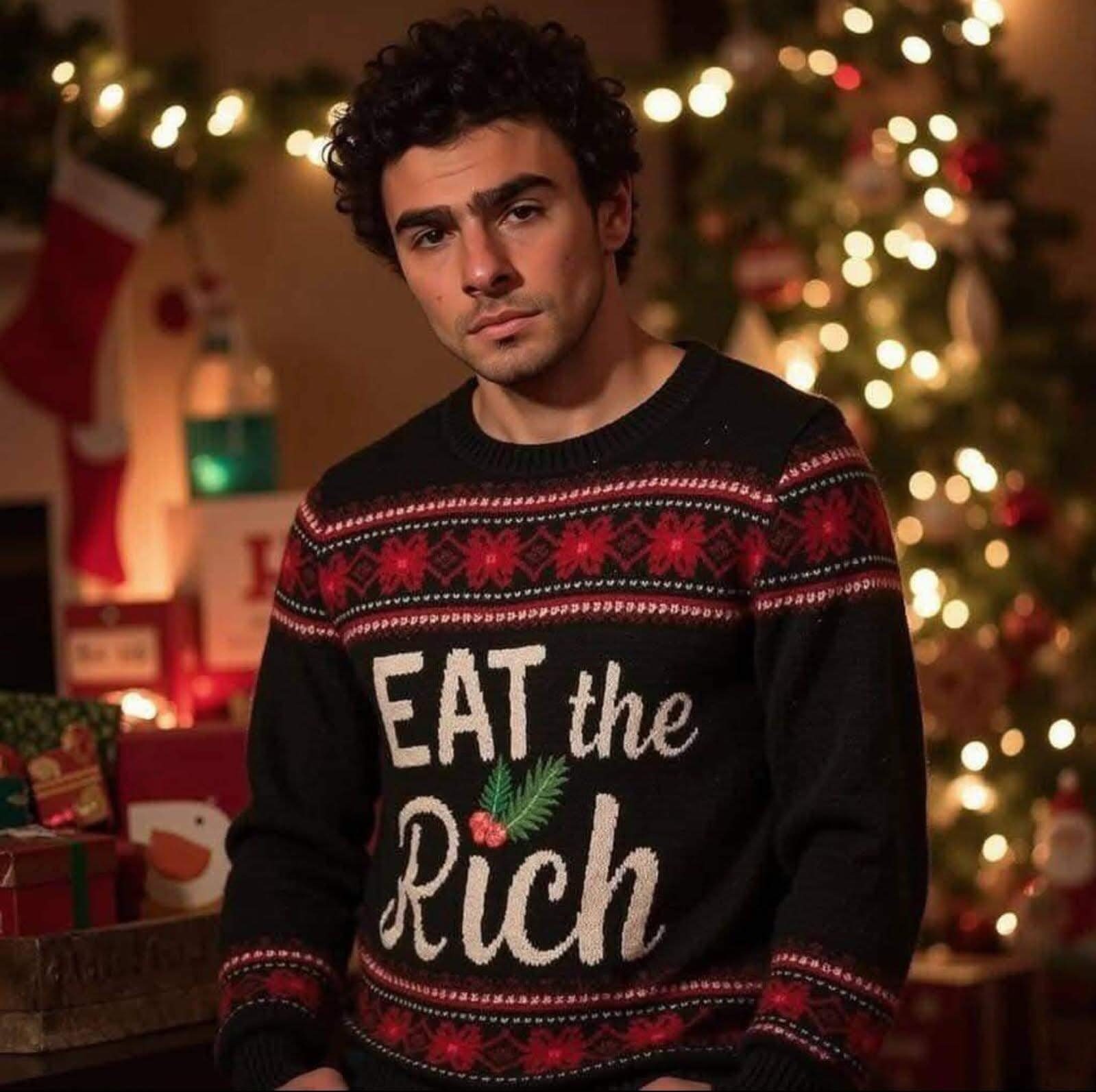 The meme is an image of a person wearing a holiday sweater with a sarcastic message. The sweater reads "Eat the Rich" in a playful, festive font, implying that the wearer is embracing a rebellious or anti-wealth sentiment during the holiday season. The image is likely intended to be humorous and ironic, poking fun at the idea of using a holiday sweater to express a provocative message.