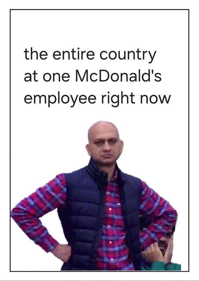 The meme features a photo of a person with a skeptical expression, likely a celebrity or public figure. The text above the image reads, "The entire country at one McDonald's employee right now." The meme is a humorous commentary on the widespread frustration and annoyance that can be felt in a single, crowded location, in this case, a busy McDonald's restaurant.
