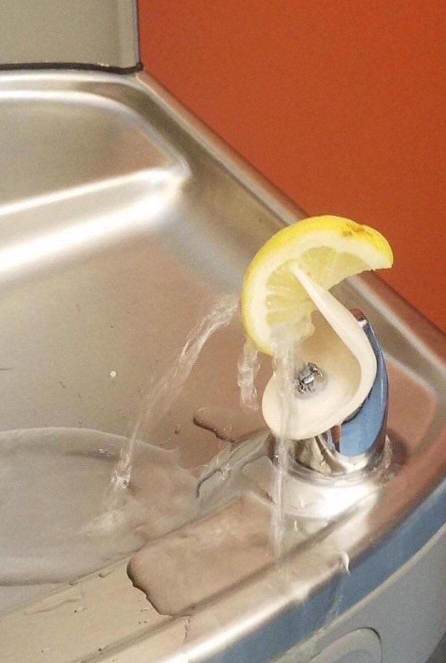 This meme features a photograph of a sink with water running and a lemon slice being squeezed into the water. The text "I'm not arguing, I'm just explaining why I'm right" appears above the image. The meme is likely referencing a situation where someone is being stubborn or refusing to listen to others.