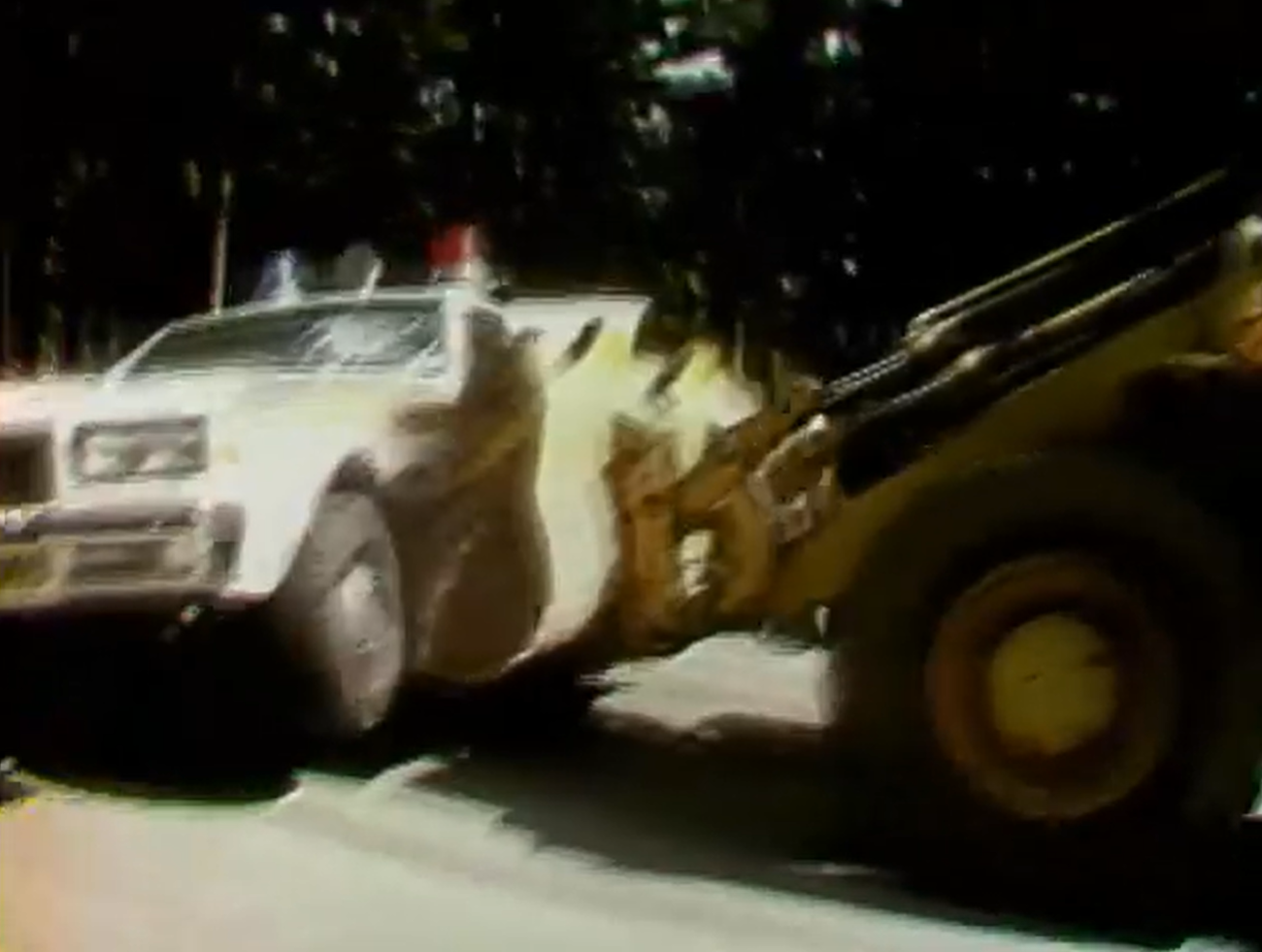 The meme is an image of a car that has crashed into a tree, with the front end severely damaged. The car is shown with a large dent in the front bumper and a smashed windshield, with a tree branch tangled in the wreckage. The image is captioned "When you finally get the hang of parking".