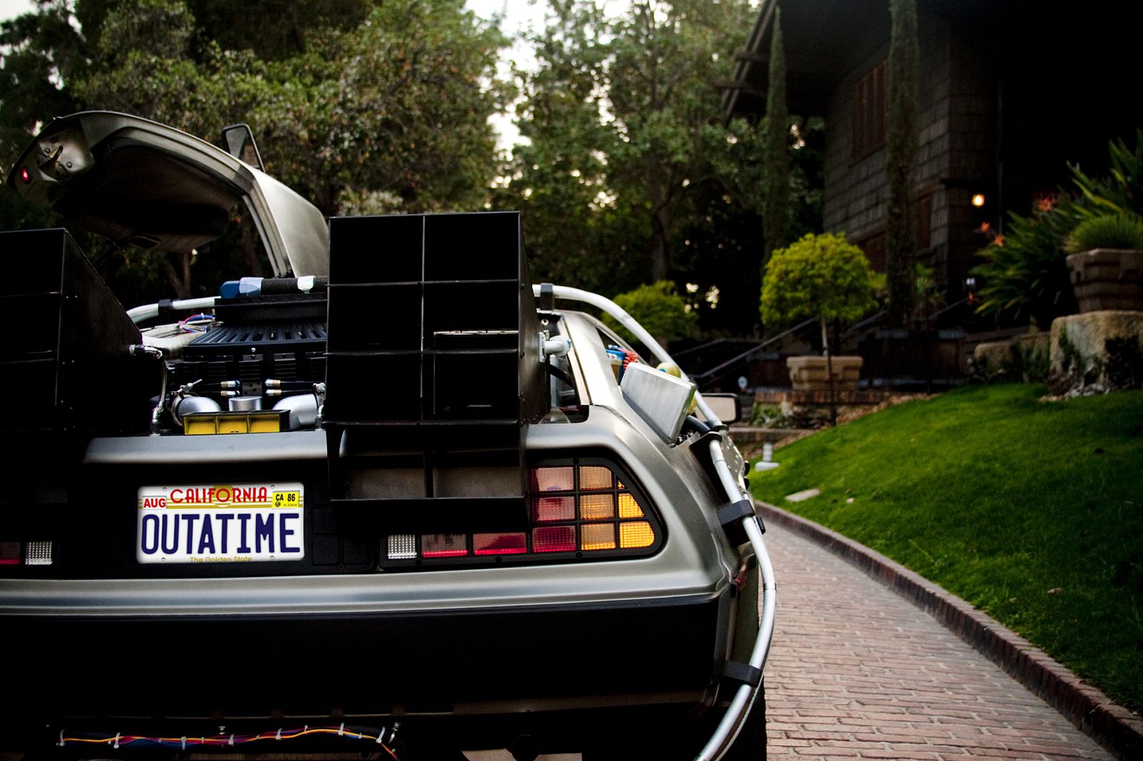 This meme is a photo of the DeLorean time machine from the movie "Back to the Future" parked in a suburban neighborhood. The text overlay on the image reads "I'm not saying I'm a time traveler, but I've been feeling like I've been stuck in a time loop for the past 5 years..."