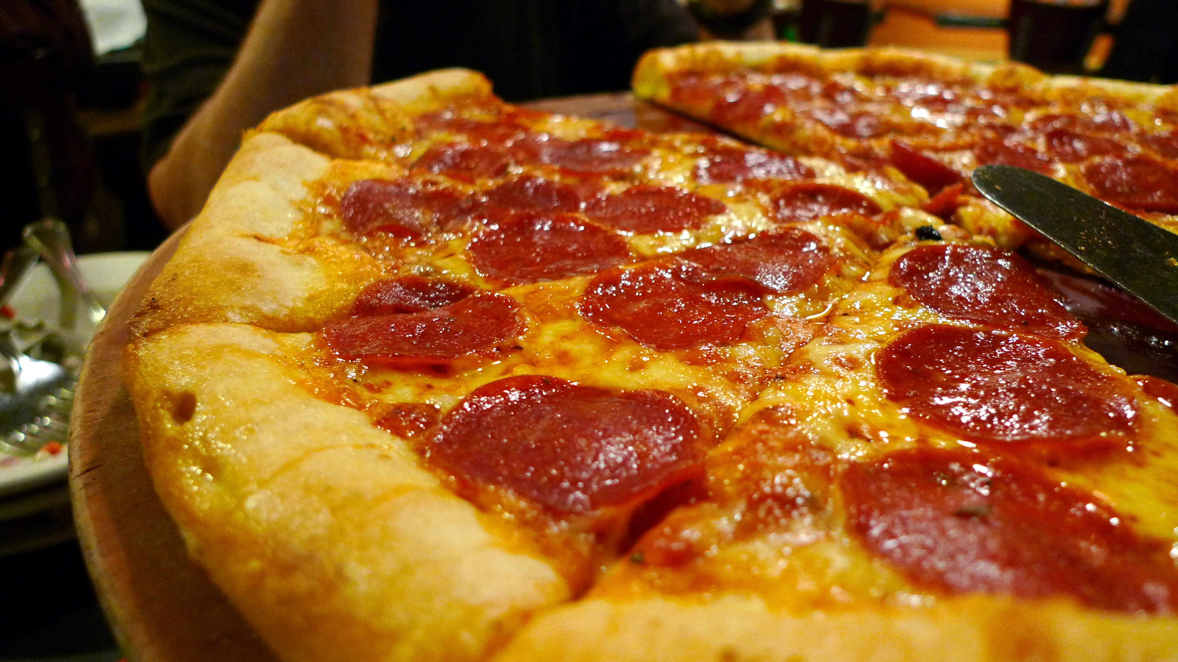 The meme is a photo of a pizza with a slice missing, implying that someone has eaten the best part. The image is captioned "When you finally get to the good stuff" and is likely used to express satisfaction or excitement when reaching a desired outcome. The meme is humorous and relatable, poking fun at the idea that the best part of a pizza is often the first bite.
