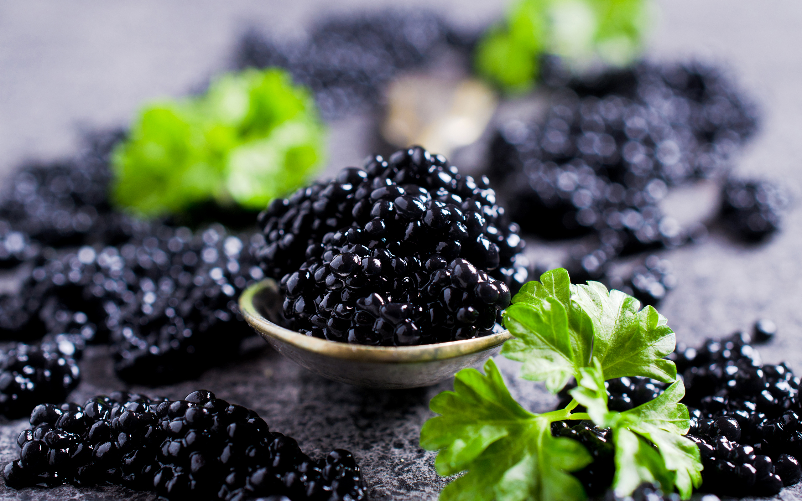 The meme is an image of a small, black, gel-like substance (caviar) with a few parsley leaves on top. The text overlay reads "When you finally get a job at a 5-star restaurant". The image is humorous because it implies that the speaker has achieved a prestigious career goal, but the small amount of caviar on the plate is a subtle reminder that even at the top, there's still room for improvement.