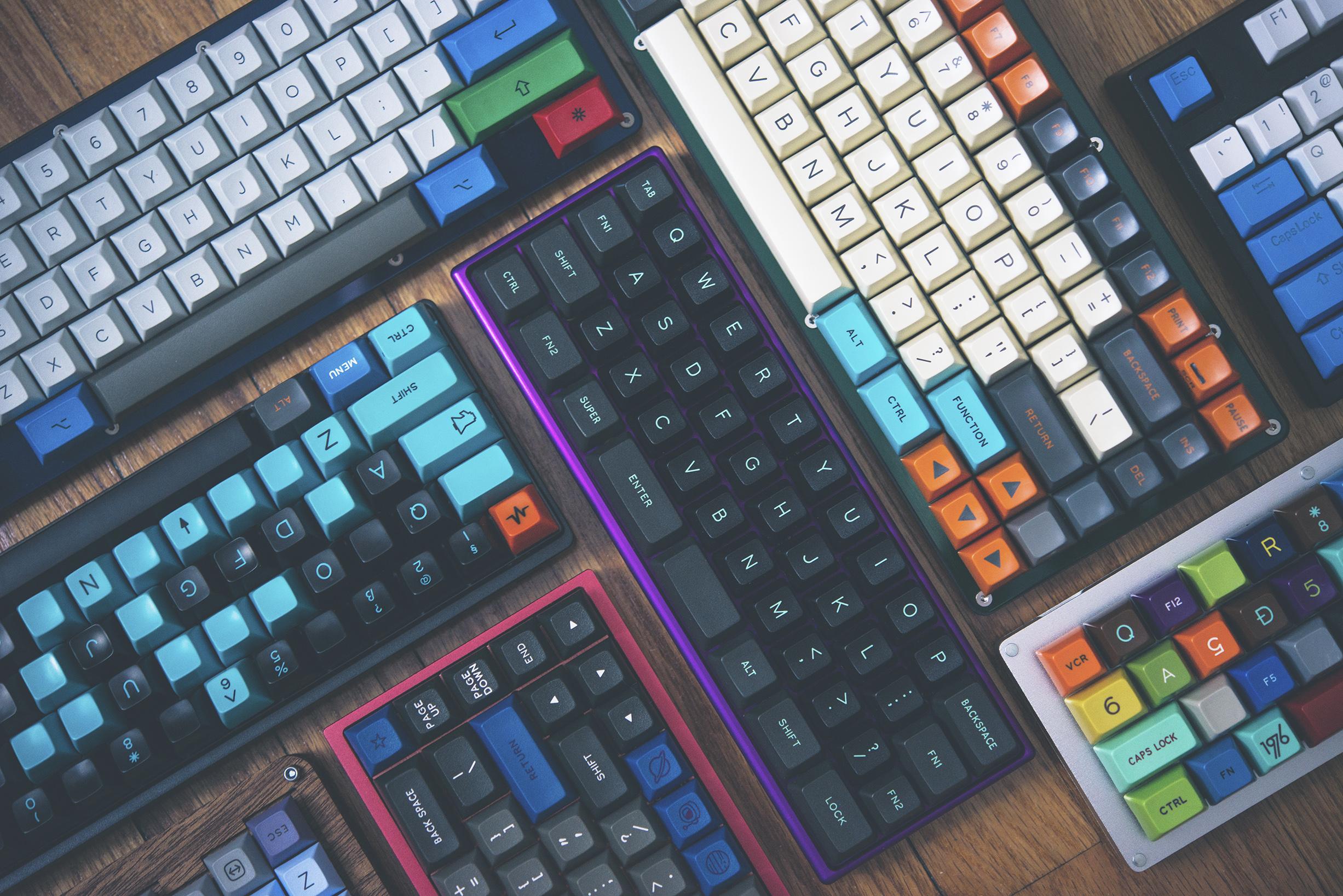 The meme is an image of a keyboard with various keys and buttons, but most of them are empty or have random characters. The image is captioned "When you're trying to be productive but your brain is just...".