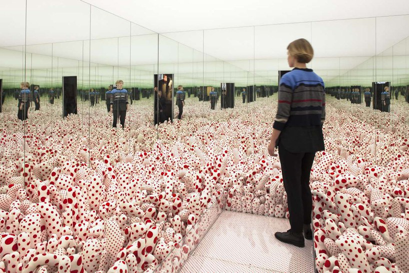 The meme is a screenshot of a person standing in front of a mirror, surrounded by a sea of identical, white, and red spotted sculptures. The text overlayed on the image reads: "When you realize you're the same person you were 10 years ago".