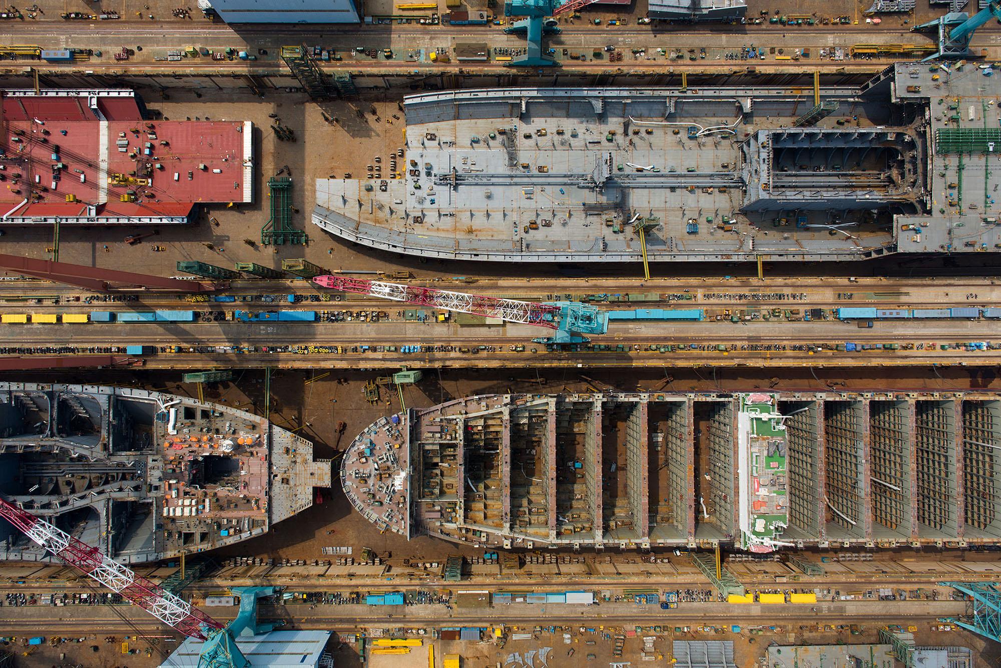This meme is an image of a large, empty shipyard with several massive ships in various stages of construction. The image is captioned "when you realize you've been on the same project for 3 years". The meme is likely referencing the feeling of being stuck in a long-term project or job, with the shipyard serving as a metaphor for the sense of stagnation and frustration that can come with it.