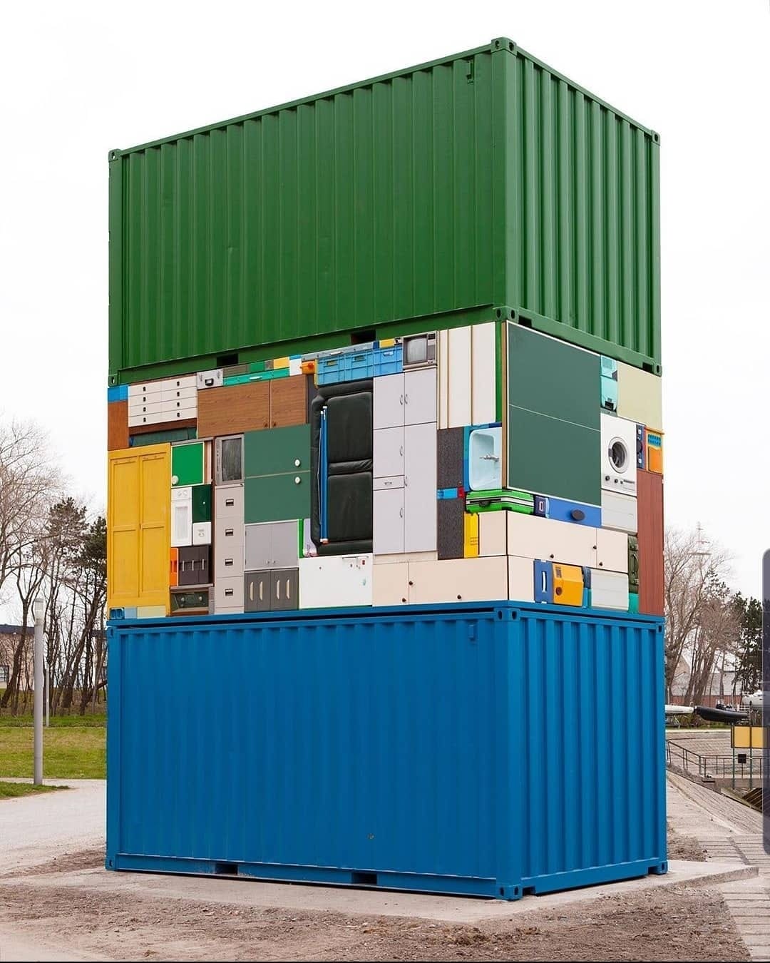 The meme is an image of a massive, sprawling, and incredibly messy city made entirely out of shipping containers, with buildings, roads, and even a giant "WELCOME TO NEW YORK CITY" sign all constructed from stacked containers. The text overlay on the image reads "New York City in 2050". The image is a humorous and satirical take on the idea of how densely populated and crowded the city might become in the future.