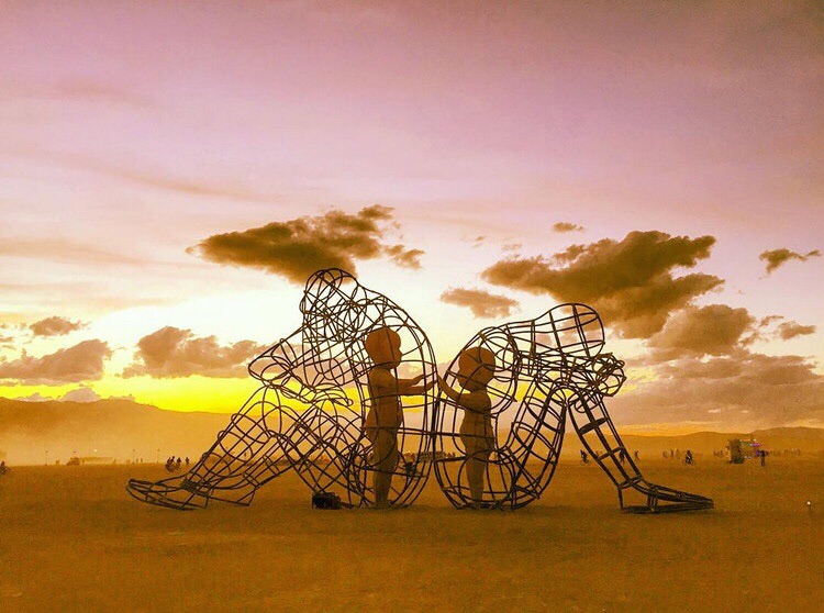 The meme is a photo of a person sitting on the ground with their head in their hands, surrounded by a large, empty space. The text "I've been sitting here for 5 hours and I still don't have a good idea for my art project" is written above the image. The image is likely a humorous take on the struggles of creative block and the importance of patience in the creative process.