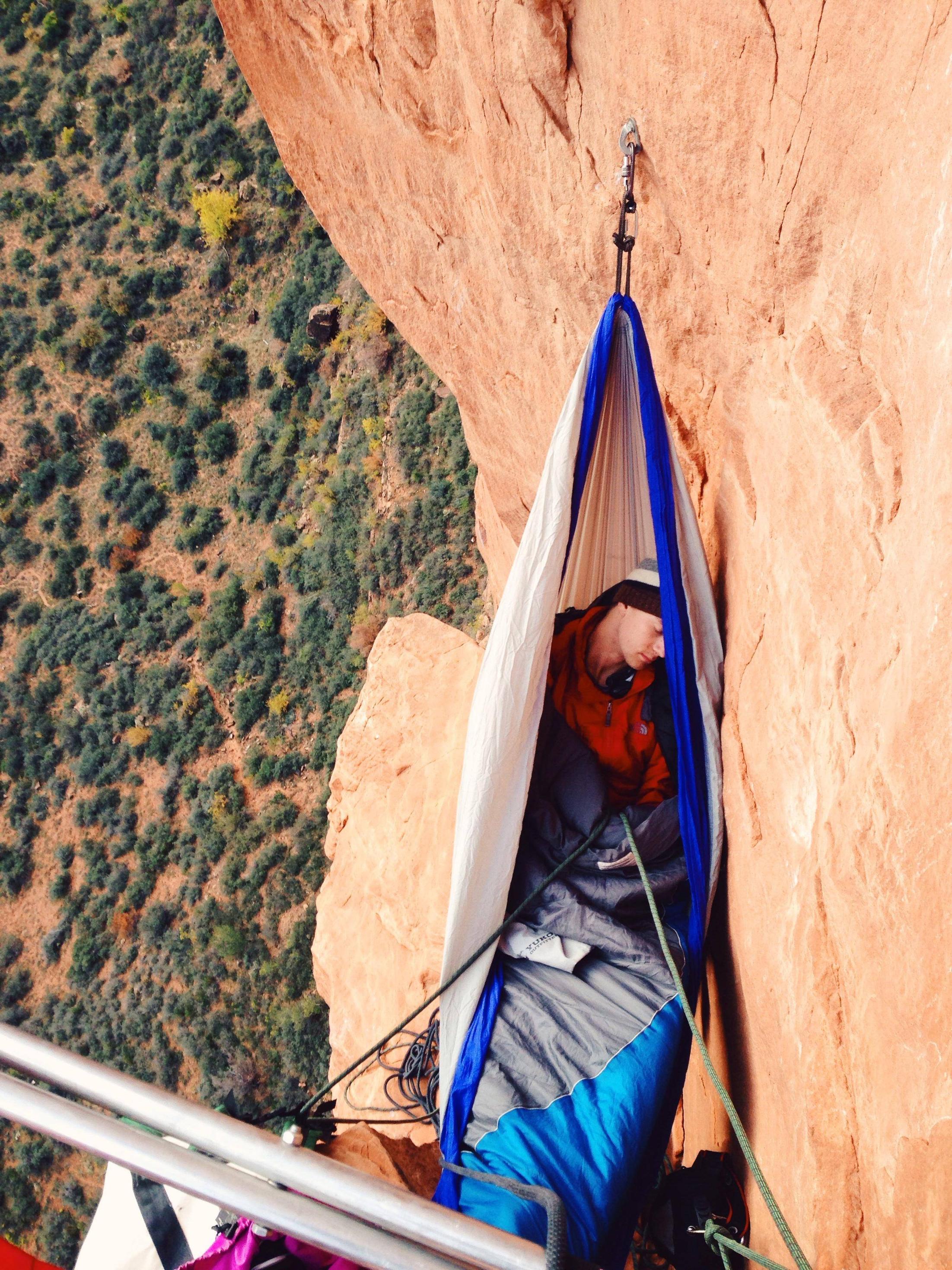 This meme is an image of a person sleeping in a hammock or "hammock" in a precarious location, such as a cliff or mountain ledge, with a caption that says "I'm not lazy, I'm just conserving energy for my next adventure". The image is likely humorous because it pokes fun at the idea of being "lazy" and instead, the person is simply preparing for their next outdoor adventure.