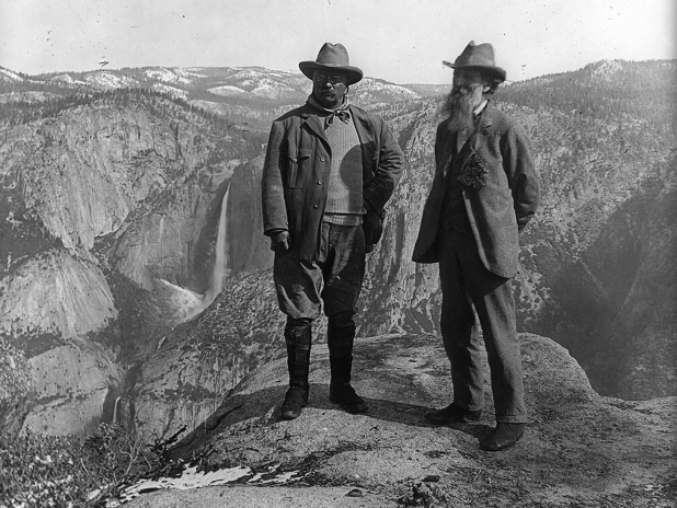 The meme is a black-and-white image of two men standing at the edge of a cliff, looking out at a breathtaking view. The text "I can see for miles" is written in a caption below the image. The meme is likely a humorous take on the idea that the view from the cliff is so expansive that the speaker can literally see for miles, but the phrase is also a common idiomatic expression meaning to be able to see or understand something from a great distance.