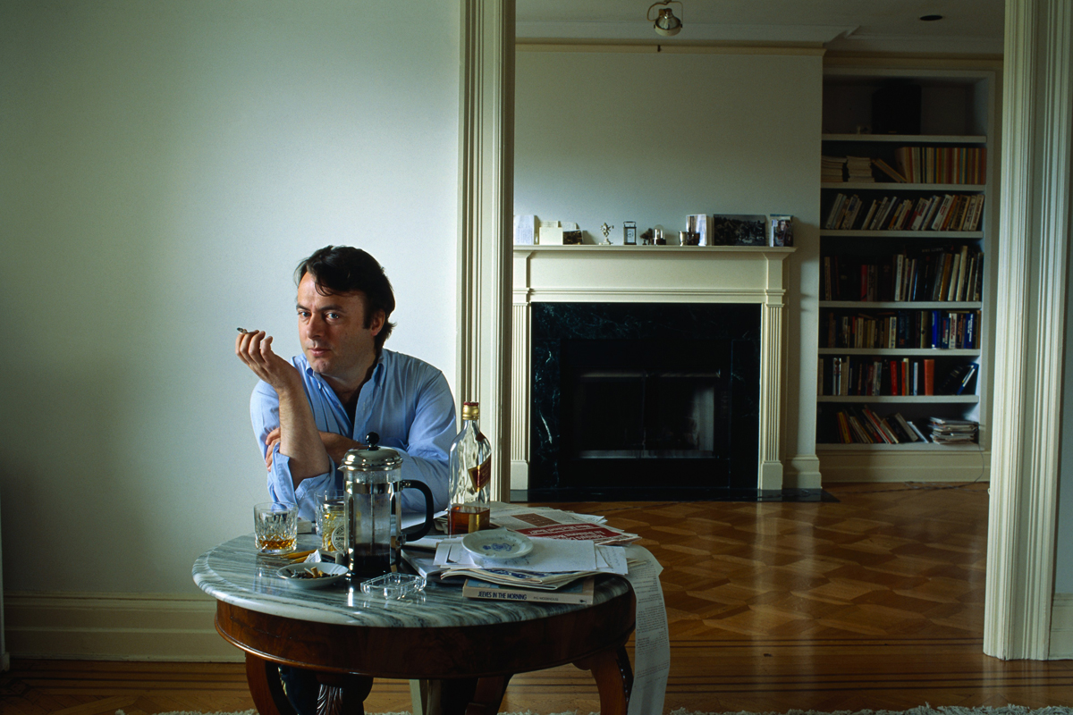 The meme depicts a person sitting at a table with a cup of coffee, a book, and a newspaper, but they appear to be in a state of disarray, with their coffee spilled, their book torn, and their newspaper crumpled. The text "I'm not lazy, I'm just on energy-saving mode" appears in the image. The meme is likely poking fun at the idea of being "lazy" and instead presenting a more relatable and humorous alternative.