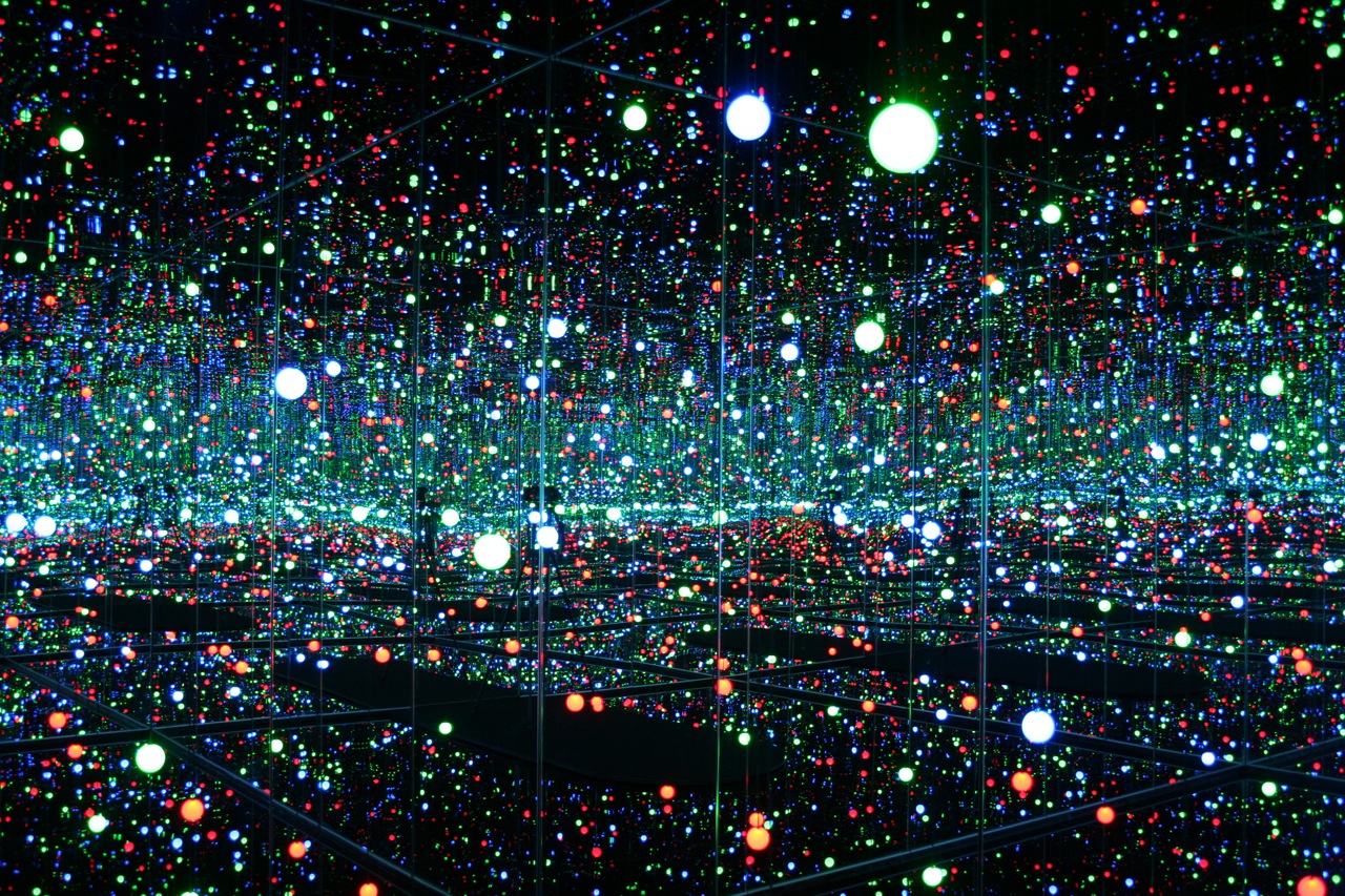 This meme is an image of a dark room filled with thousands of twinkling lights. The text "I can see my house from here" is written in a small, curved font at the top of the image. The image is a reference to the classic 1986 film "Popeye" and is meant to be humorous.