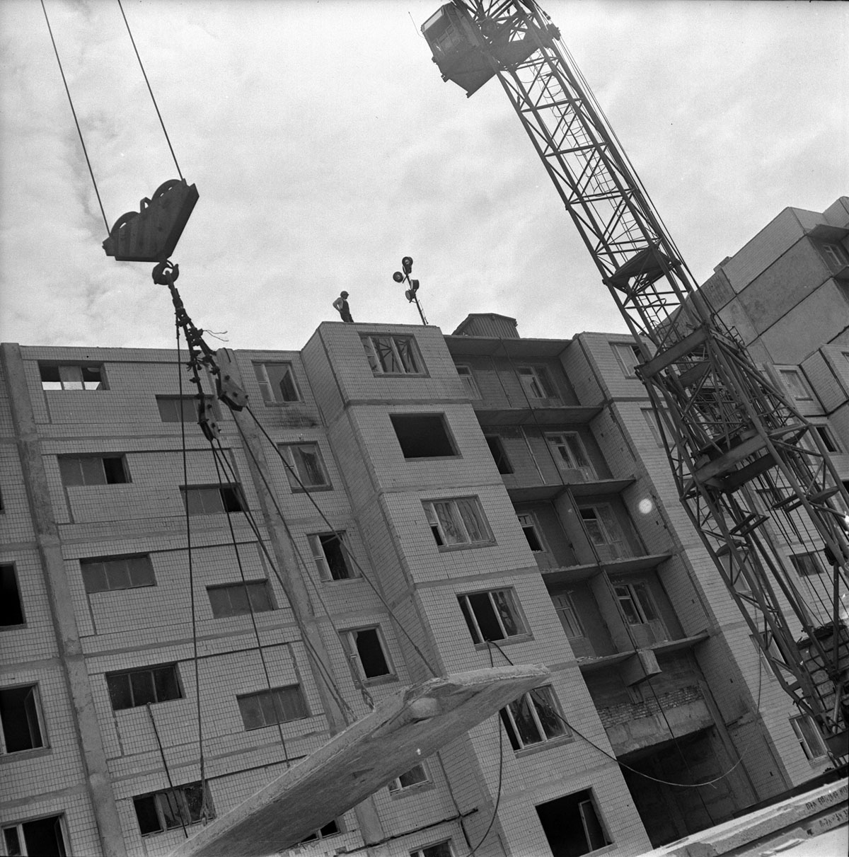 The meme is an image of a building under construction with a giant, broken concrete slab hanging precariously from a crane. The image is captioned "Permaculture - Shelter" and features a quote from a permaculture expe...