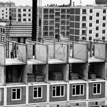 The meme is a humorous image of a permaculture-inspired shelter, with a sign that reads "Free Hugs" and a person standing on top of a tree, with a sign that says "Permaculture" and a picture of a tree. The image is a...