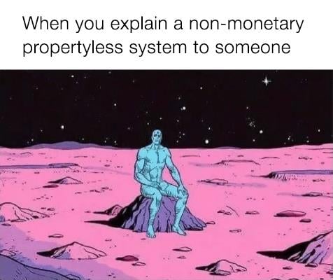 This meme is a humorous illustration of a person sitting on a rock in a desolate, red-colored landscape. The image is captioned "When you explain a non-monetary, property-less system to someone" and is likely meant to poke fun at the challenges of explaining complex, abstract concepts to others. The image is likely a playful, cartoon-style depiction of a person in a surreal, otherworldly environment.