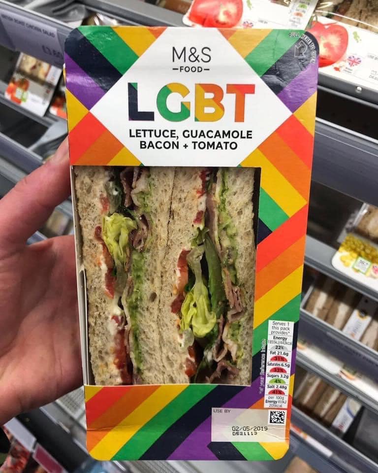 This meme is an image of a packaged sandwich from the UK supermarket chain Marks & Spencer, with the name of the sandwich being "LGBT" (an acronym for Lesbian, Gay, Bisexual, and Transgender). The text "LGBT" is in the same font and color scheme as the brand's logo, implying that the sandwich is a playful and humorous reference to the LGBTQ+ community. The image is likely meant to be ironic or satirical, poking fun at the idea of a sandwich being named after a community.