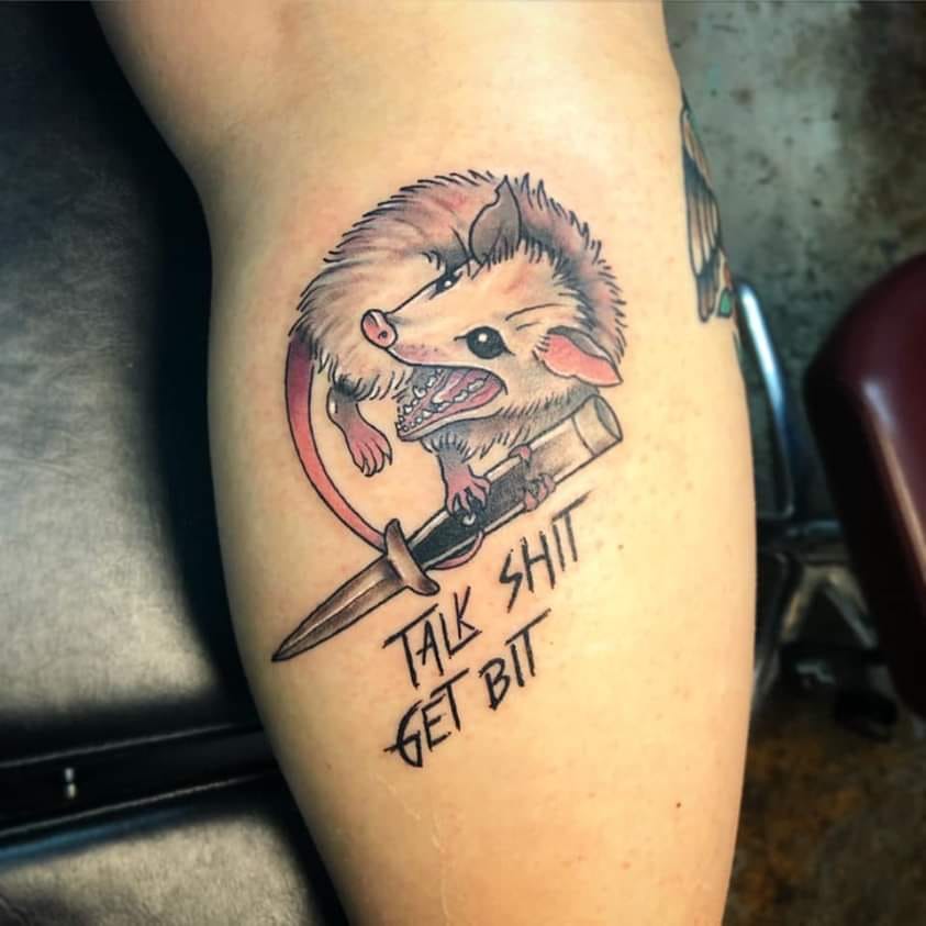 The meme is an image of a cartoon rat with a tattoo of a rat holding a knife, with the text "I can smell the desperation" written above it. The image is likely referencing a common internet joke about getting tattoos of rats, and the text is a humorous commentary on the idea of getting a tattoo of a rat, which is often seen as a symbol of poverty or desperation.