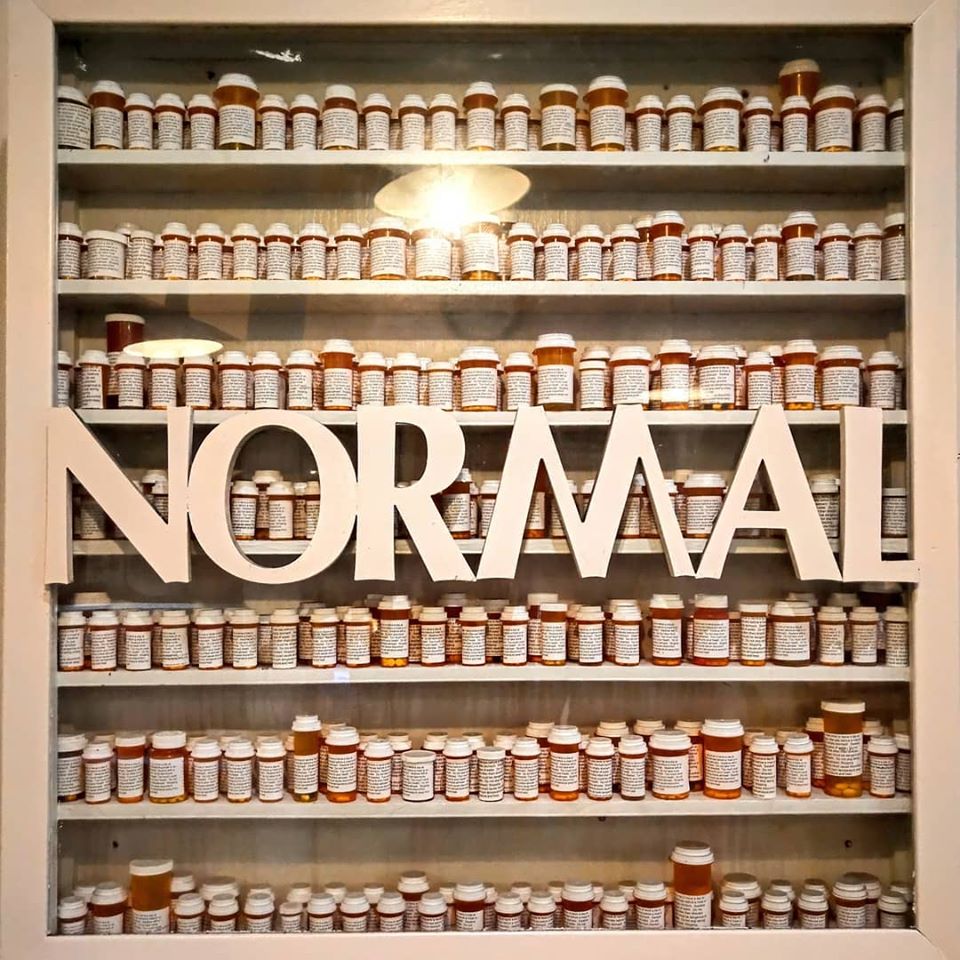The meme is a photo of a cabinet with rows of pill bottles, each labeled with a prescription medication. The text "I'm not arguing, I'm just explaining why I'm right" appears in a bold, white font above the bottles. The image is a humorous commentary on the idea that someone is being overly defensive or argumentative, and is using a "prescription" of excuses to justify their behavior.