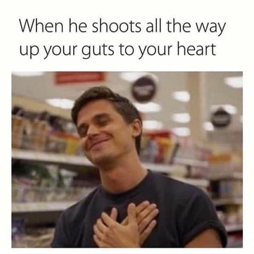 The meme is an image of a person with a surprised expression, with their hands on their heart. The text "when he shoots all the way up your guts to your heart" is written above the image, implying that someone has deeply hurt or offended the person. The image and text convey a sense of shock, pain, and betrayal.