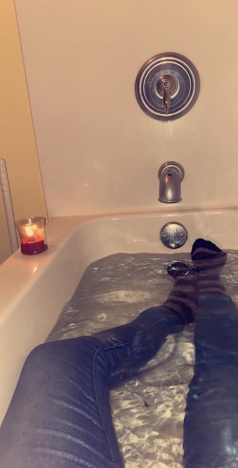 The meme is an image of a person sitting in a bathtub with their legs stretched out, surrounded by candles and a book. The text "I can smell the desperation" appears in a speech bubble above the person's head, implying that they're trying to relax and unwind but are actually feeling anxious and stressed. The image is a humorous take on the idea that even in a relaxing situation, people can still feel overwhelmed.