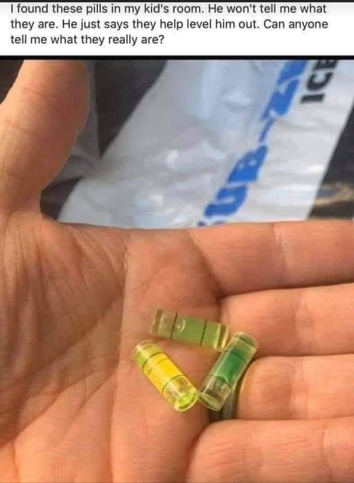 The meme is a photo of a hand holding a few small, brightly colored pills, with the text "I found these in my kid's room. I have no idea what they are, but they say 'take me' on them." The image is likely meant to be humorous, implying that a child has been taking medication without permission or understanding its effects.