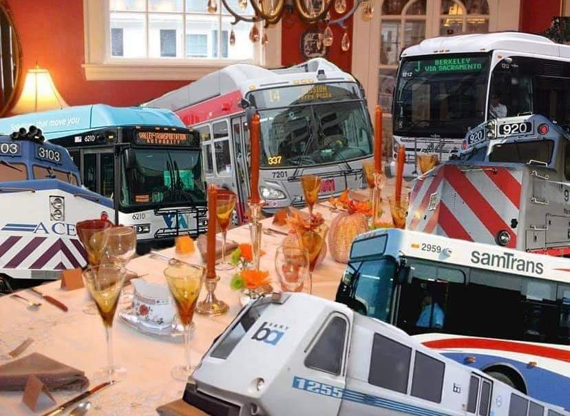 The meme is a humorous image of a dinner table set with fine china and a lavish meal, but instead of guests, a row of buses is seated at the table. The caption reads "When you have to bus in all your friends for dinner". The meme is poking fun at the idea of having a large social gathering and needing to make special arrangements to accommodate all the guests.