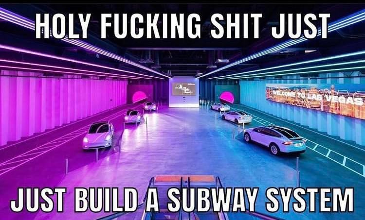 This meme is a humorous and satirical image featuring a futuristic cityscape with towering skyscrapers and flying cars, but with a twist: the city is actually being built by a giant, slow-moving, and seemingly incompetent worm that's laying a massive underground tunnel system. The text overlay reads: "Just build a subway system, it's 2023." The meme pokes fun at the idea that, despite having advanced technology, we're still struggling to build basic infrastructure like a subway system.