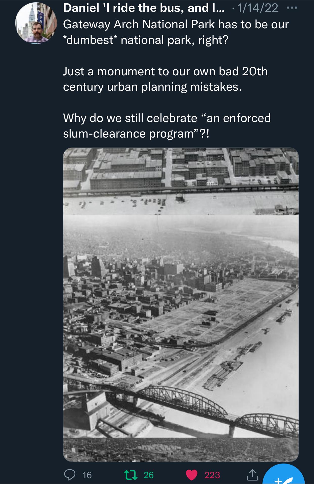 The meme is a photo of a cityscape with a large, vacant lot in the center, surrounded by buildings and a river. The text above the image reads: "In 1954, the city of St. Louis built a massive highway that cut through the middle of the city, destroying dozens of neighborhoods and displacing thousands of residents. Today, we still celebrate this achievement with a highway that's been named after the man who made it possible: The Dan McLaughlin Memorial Highway."