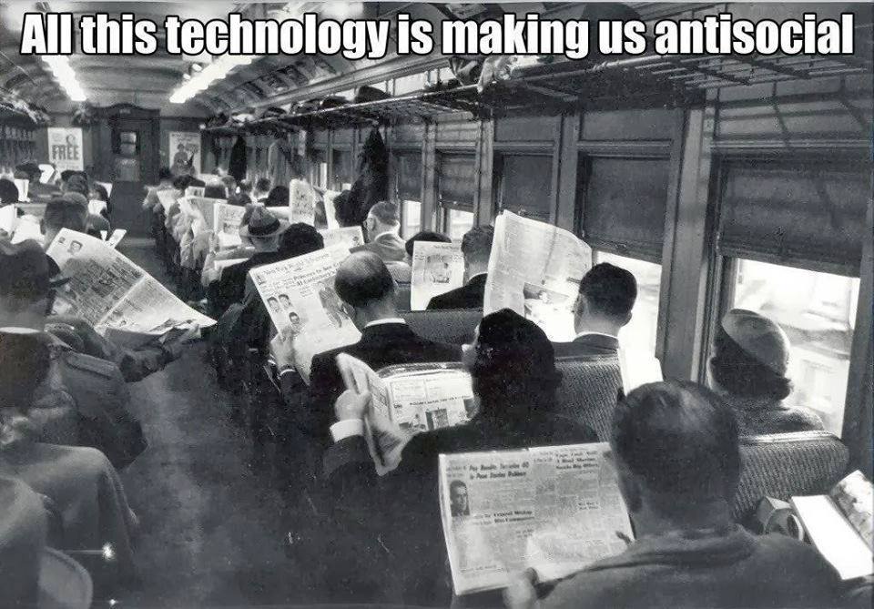 This meme is a play on the classic 1950s photo of a packed subway car, but with a modern twist. The original image shows a crowded subway car with people reading newspapers, but in this meme, the text "In 2-3 sentences, describe this meme for someone who cannot see it" is overlaid on top of the image, making it a self-referential joke about the difficulty of describing a visual image to someone who can't see it.